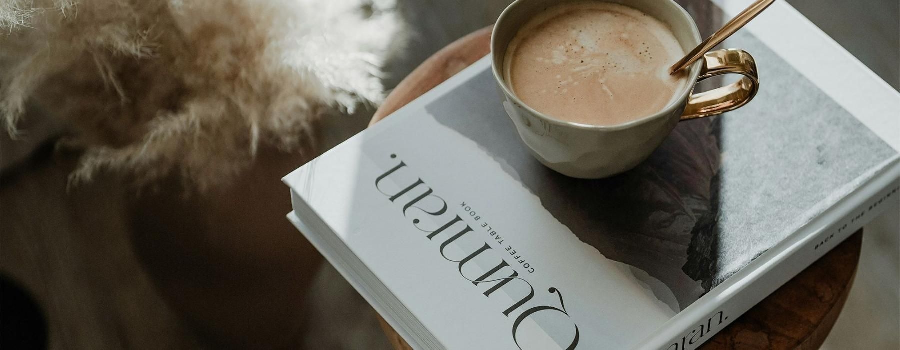 a cup of coffee on a book