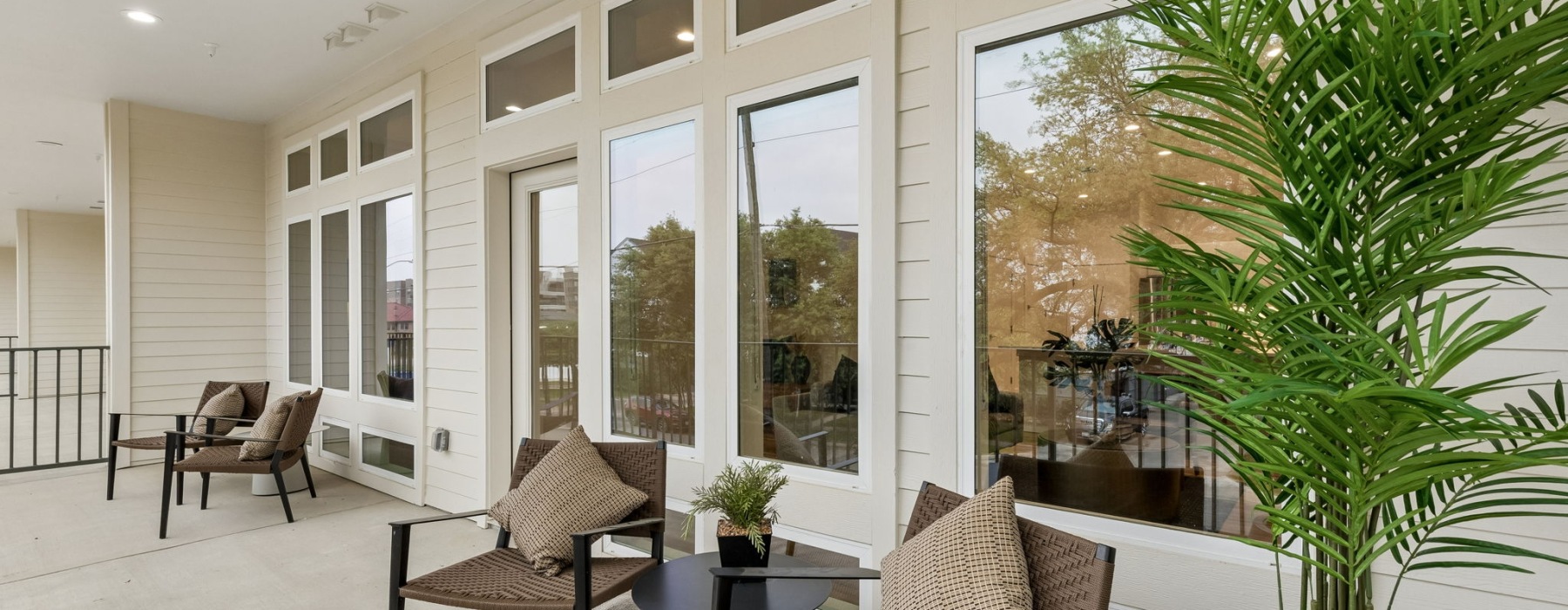 a patio with seating and plants